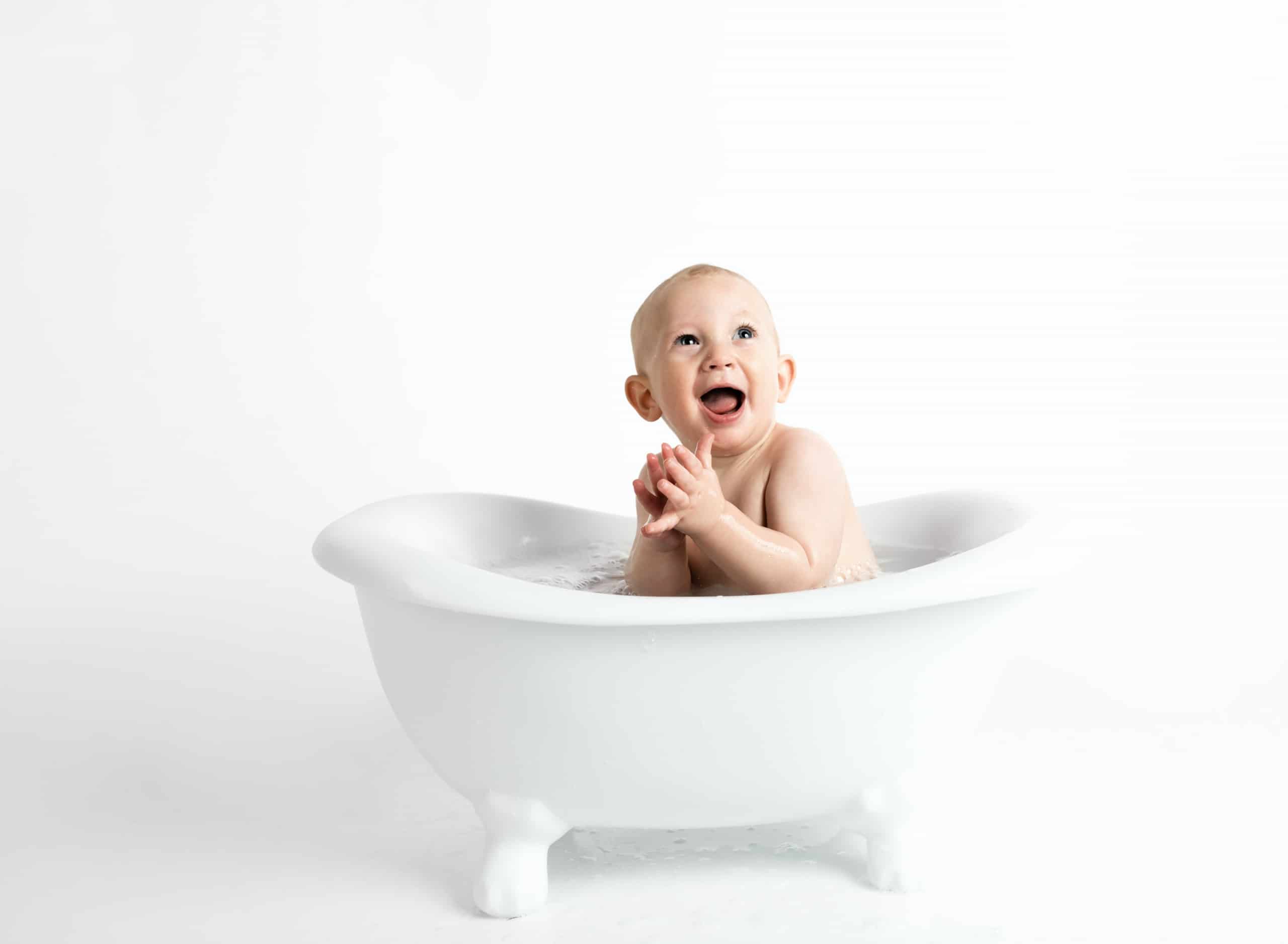 Baby Smiling in a Bathtub